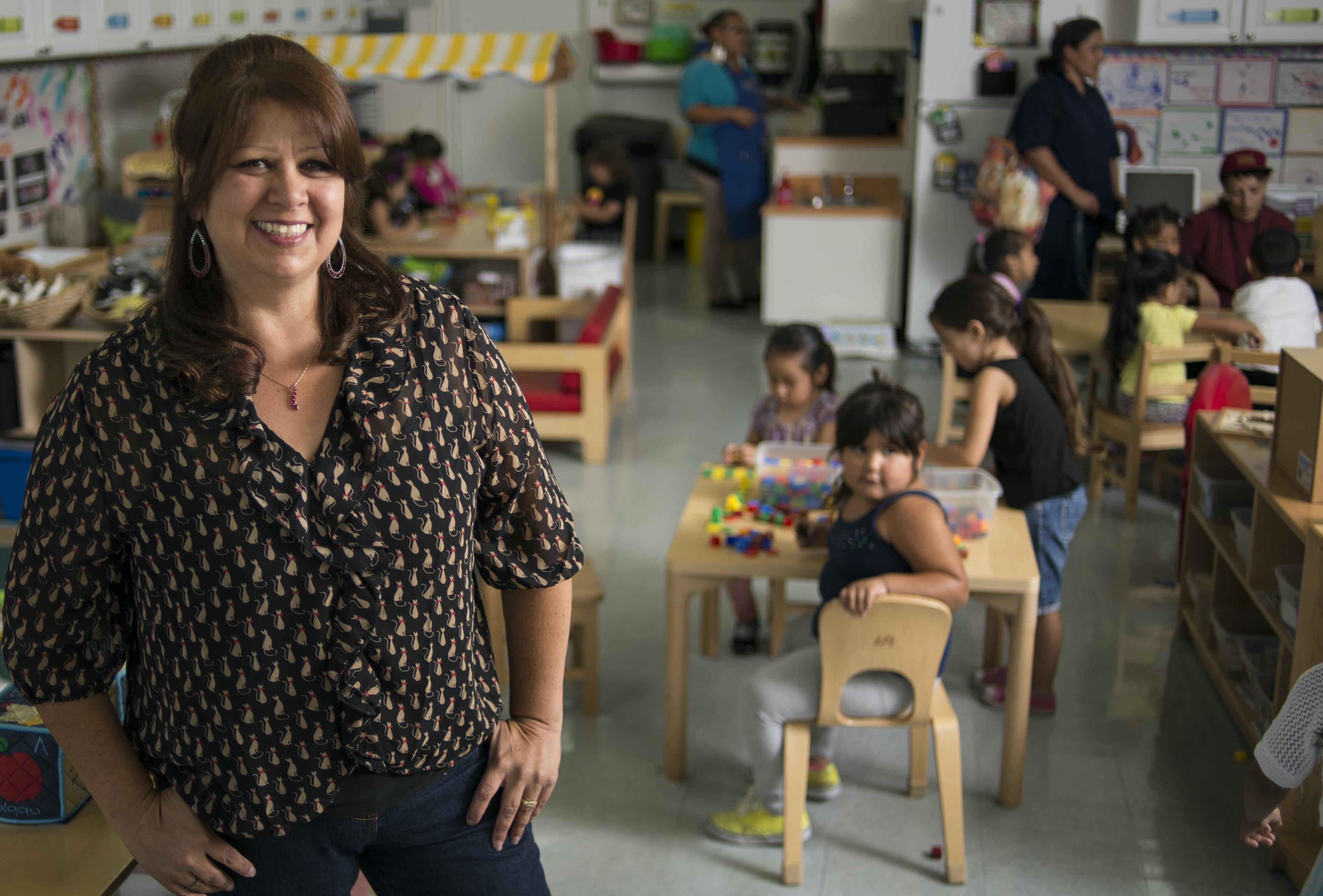 Teacher in classroom with children